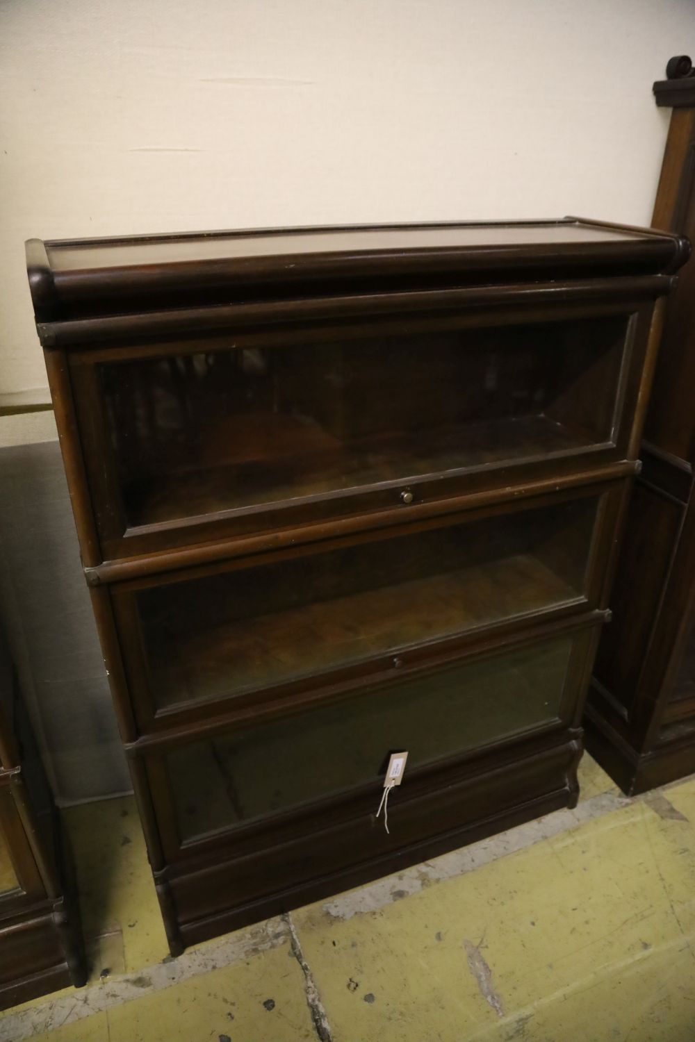 A set of two Globe Wernicke four section mahogany bookcases and a three section Globe Wernicke bookcase, width 86cm, depth 27cm, larges